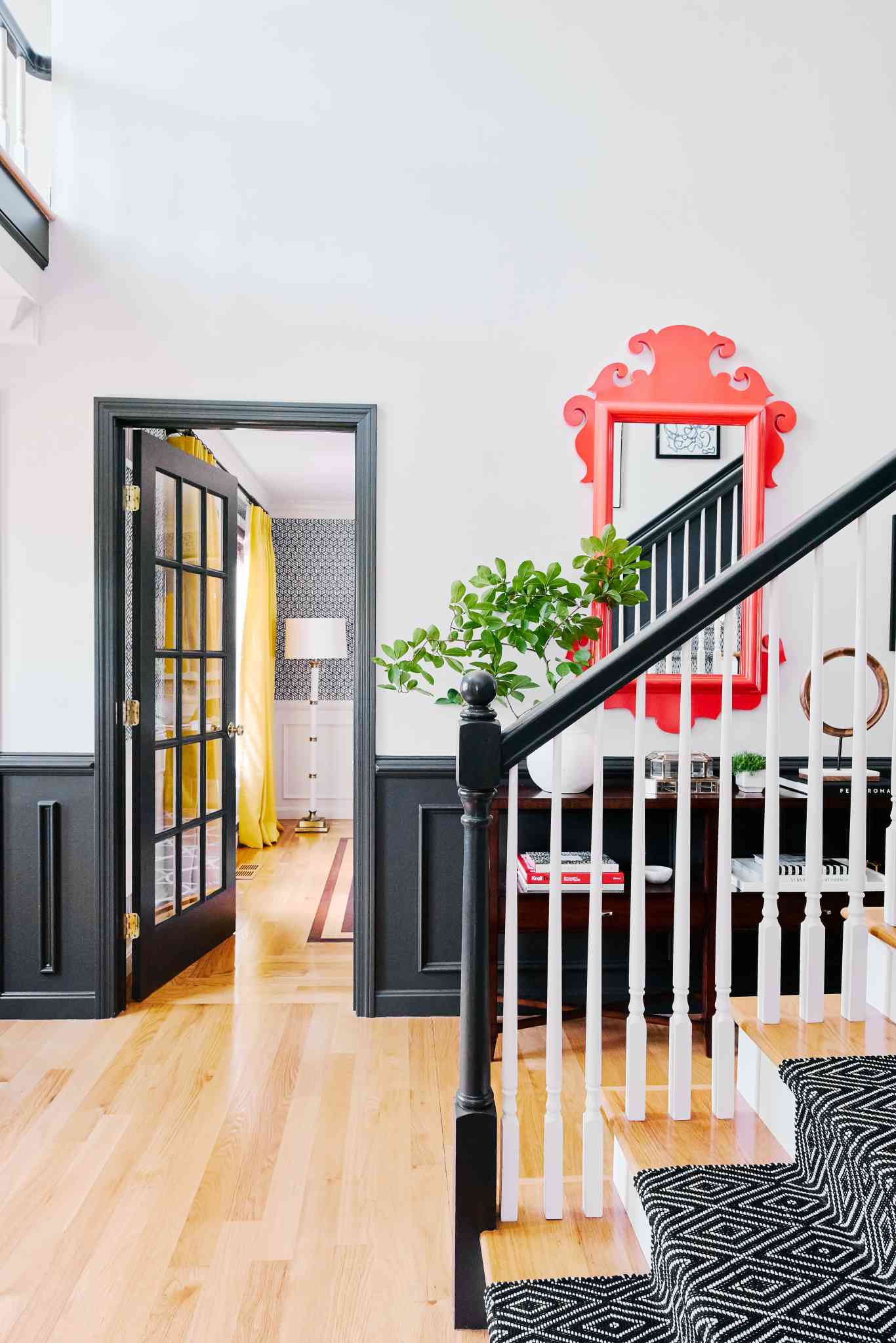 chair rail in entryway with black accents
