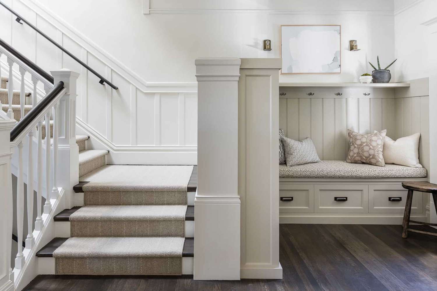 chair rail on a staircase with a mudroom nook