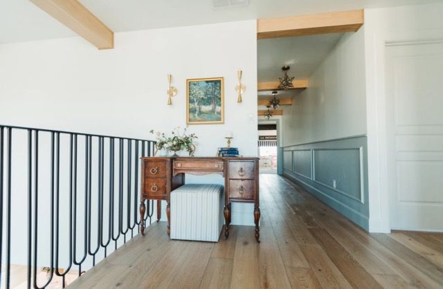 chair rail in a large hallway with a desk nook