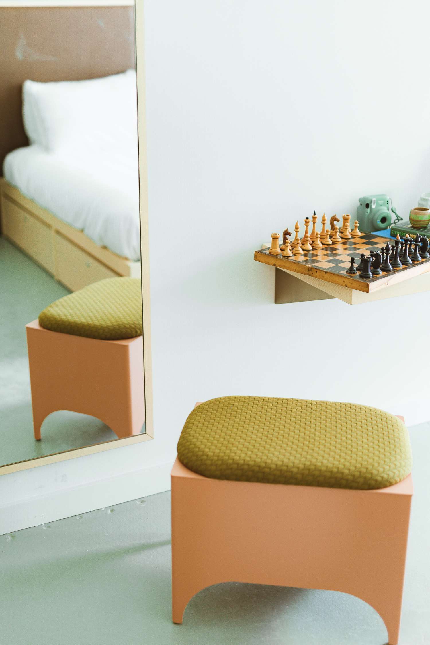 hotel suite with petite stool and chess sett