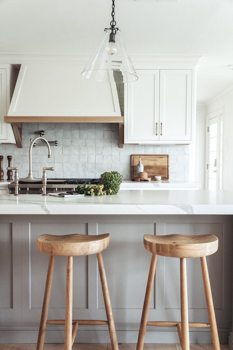 white Shaker cabinets with wood bar stools