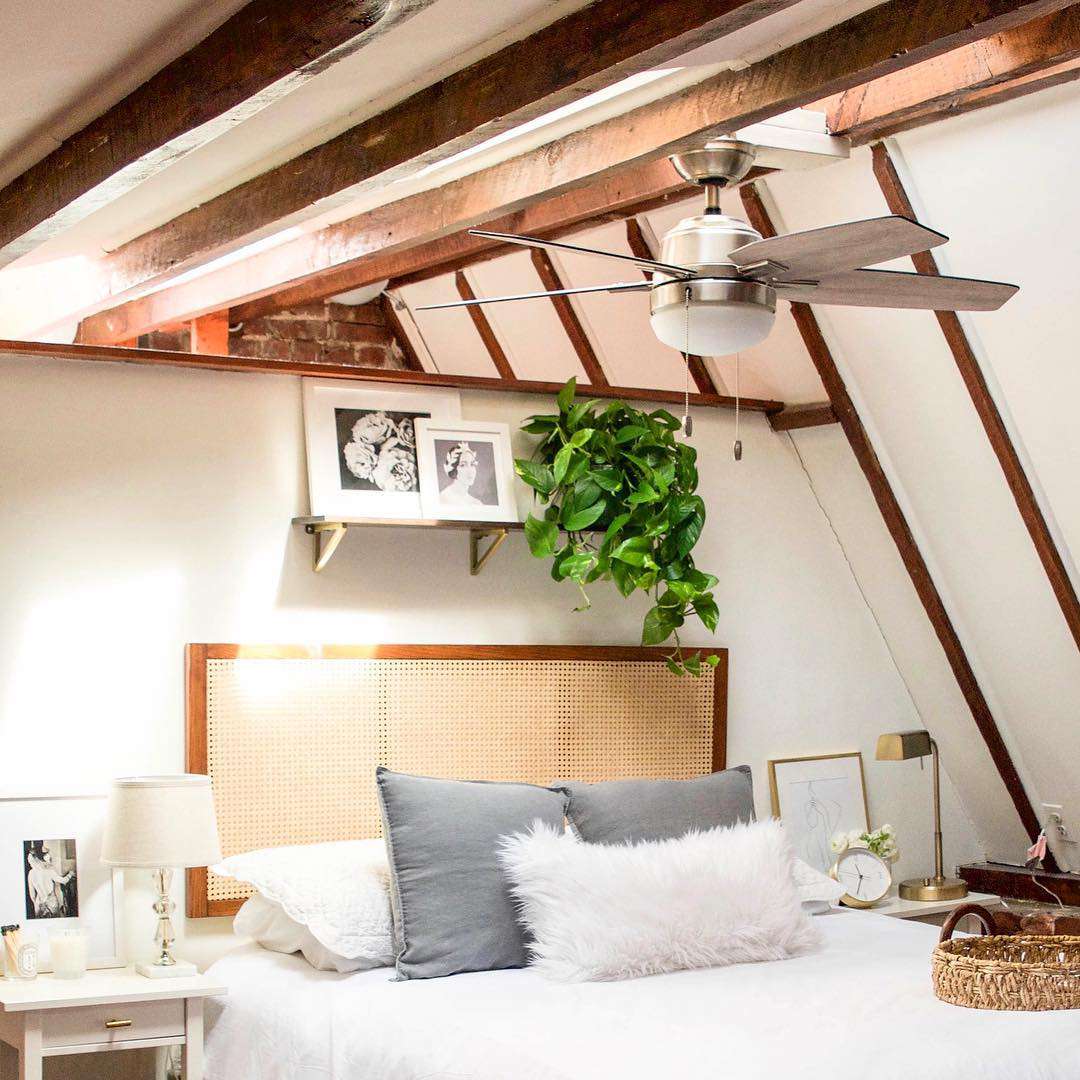 fan hanging above bed